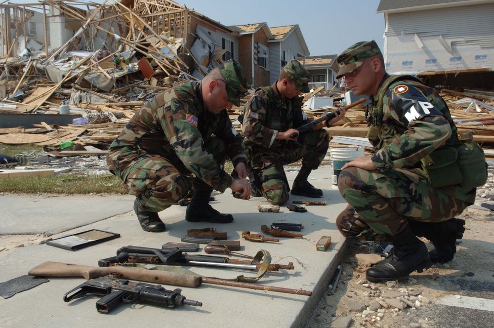 National Guard Secures Weapons from Hurricane Katrina Rubble