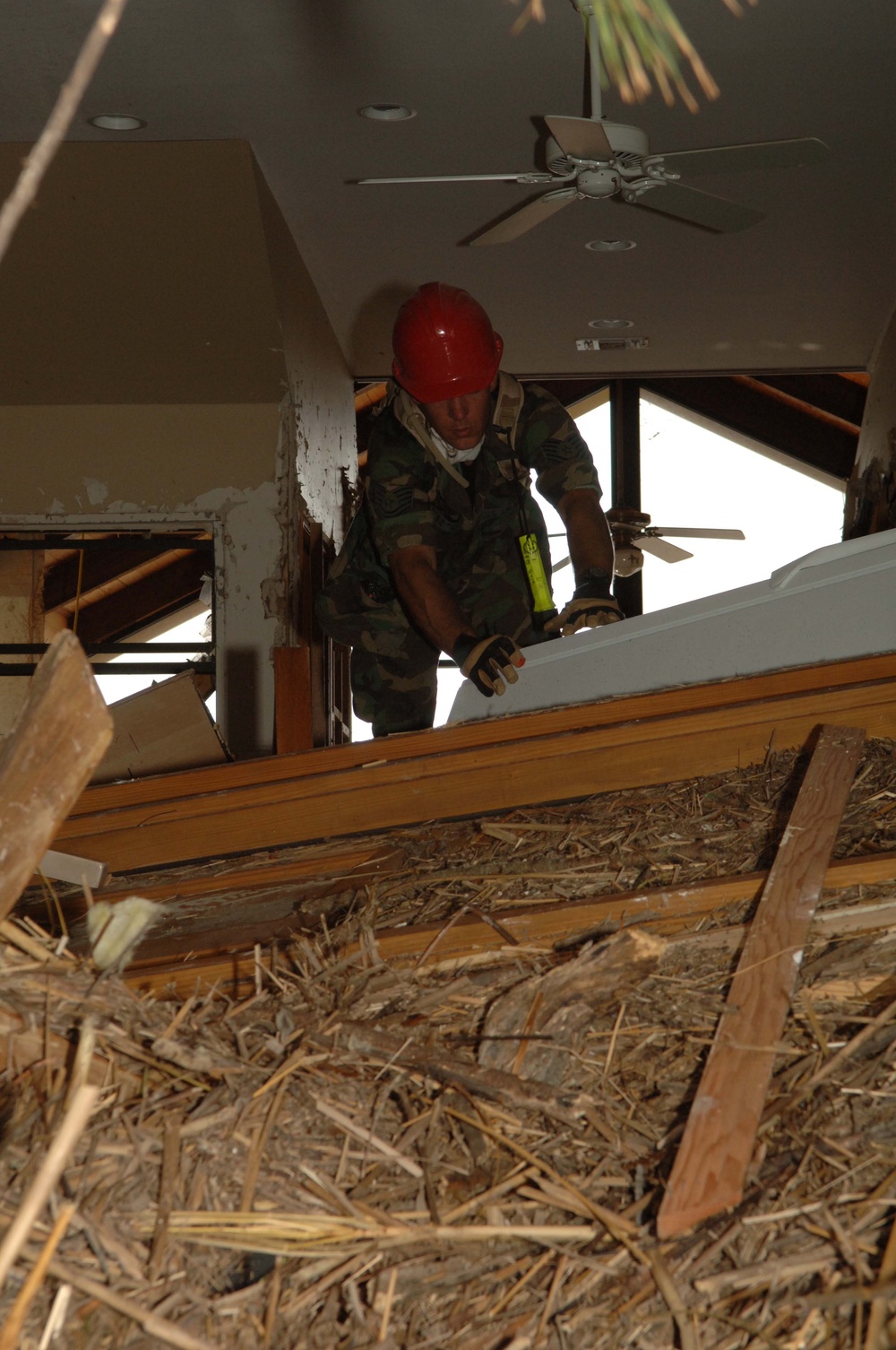 National Guard Firefighter Searches Damaged Home After Hurricane Katrina
