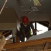 National Guard Firefighter Searches Damaged Home After Hurricane Katrina
