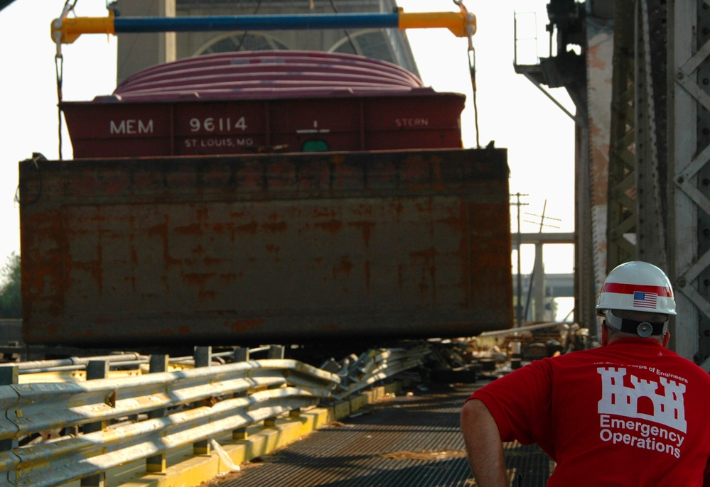 Army Corps Oversees Removal of Katrina-Stranded Barge from New Orleans Bridge