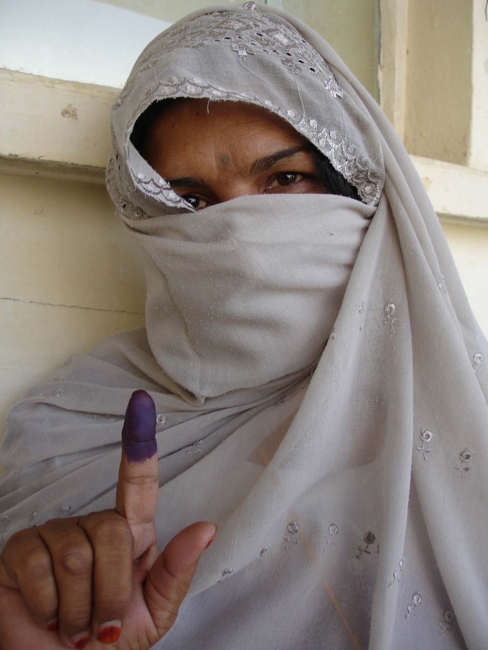 Afghan Woman Proudly Shows Ink-Stained Finger After Voting