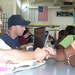 FEMA Employee Assists Hurricane Katrina Victim in New Orleans