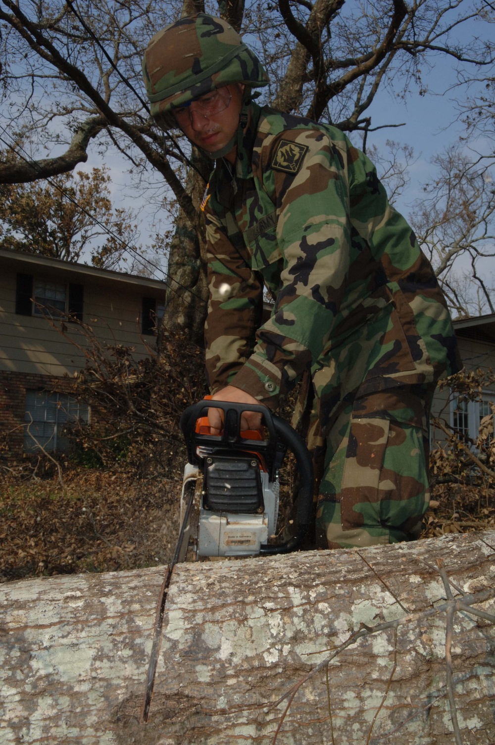 National Guard Soldier Clears Debris After Hurricane Katrina Hits Mississippi Coast