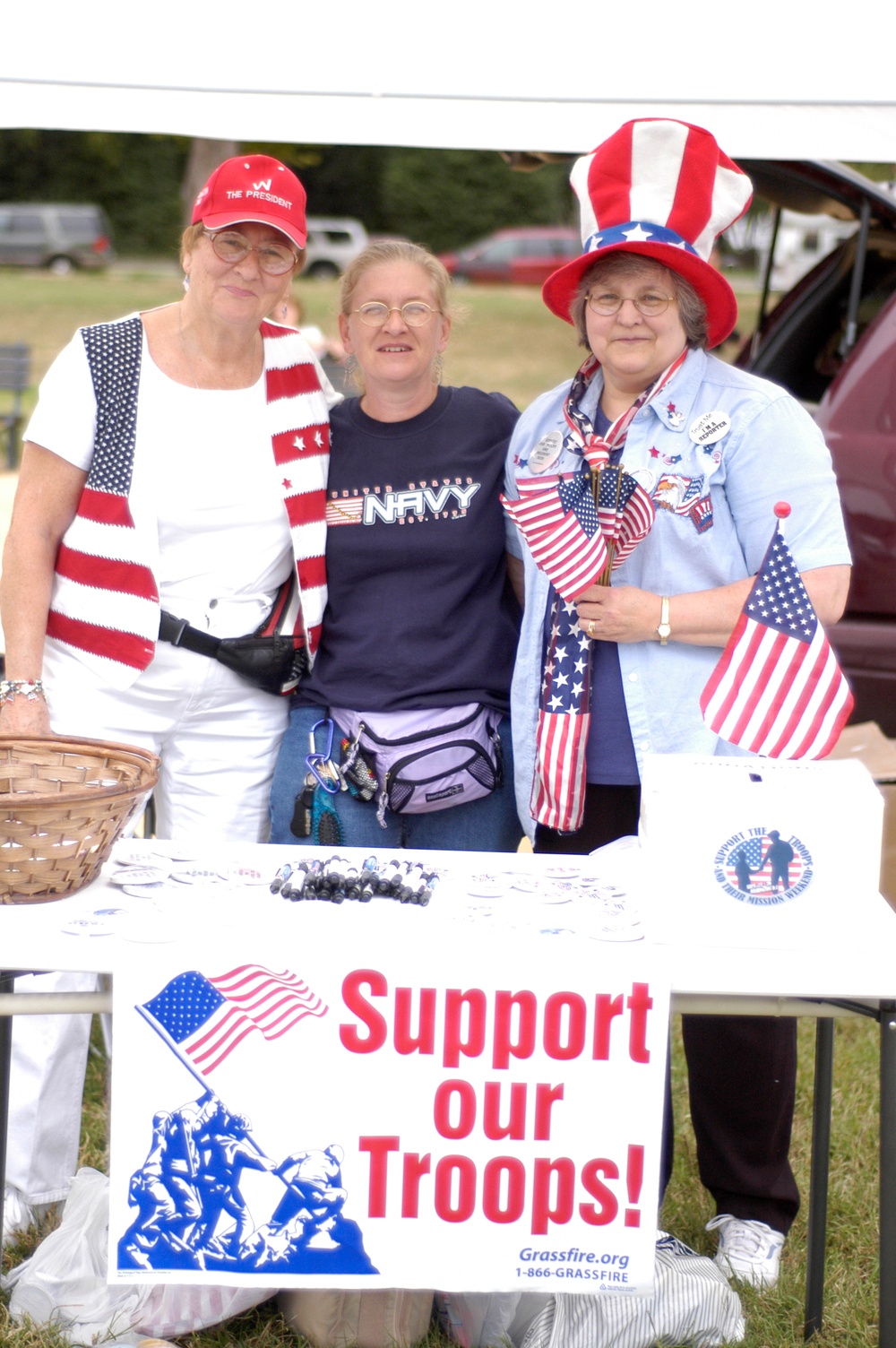 Activists Distribute Free Buttons at Rally to Honor Military Families