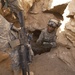 Army Soldier Inspects Demolition Charge in Iraq Cave