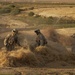 Soldiers Search Haystack for Weapons Cache in Iraq
