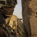 Soldier Provides Security During Weapons Search in Iraq