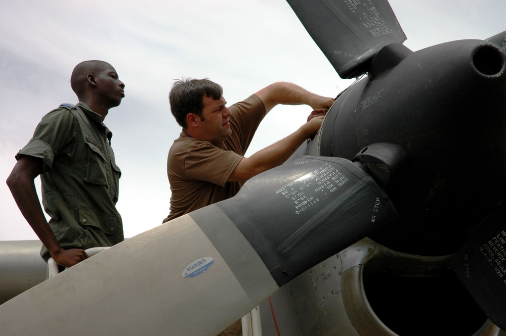 U.S. Airman Trains Nigerien Counterpart on C-130 Turboprop Maintenance