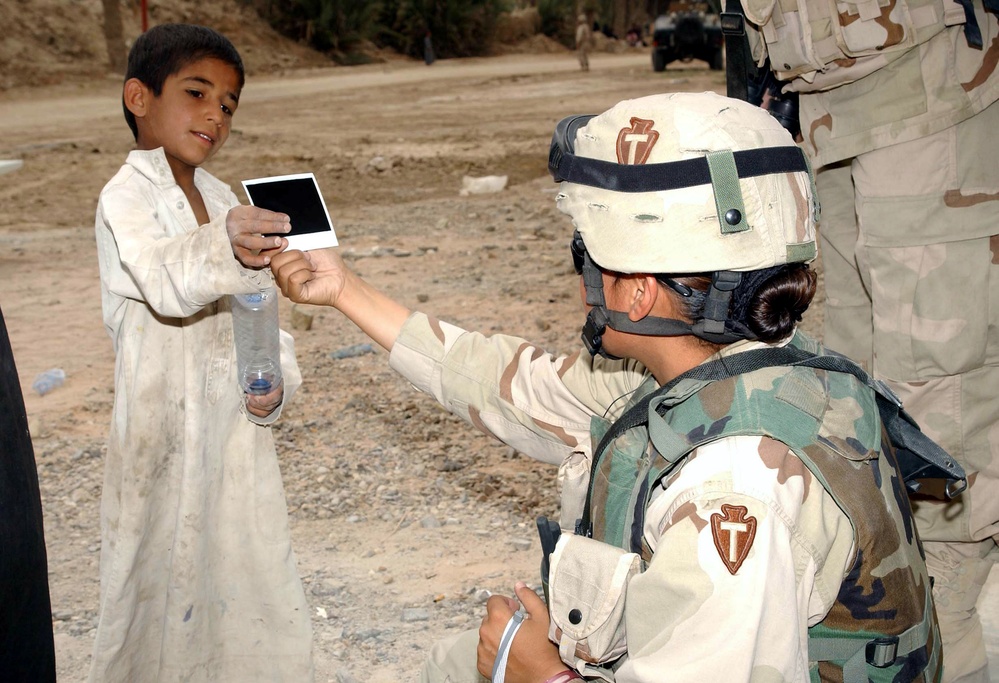 Texas National Guard Soldier Connects with Iraqi Youth During School Construction Visit
