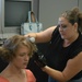 Stylist Preps Soldier for Photo Shoot at Fort Sam Houston