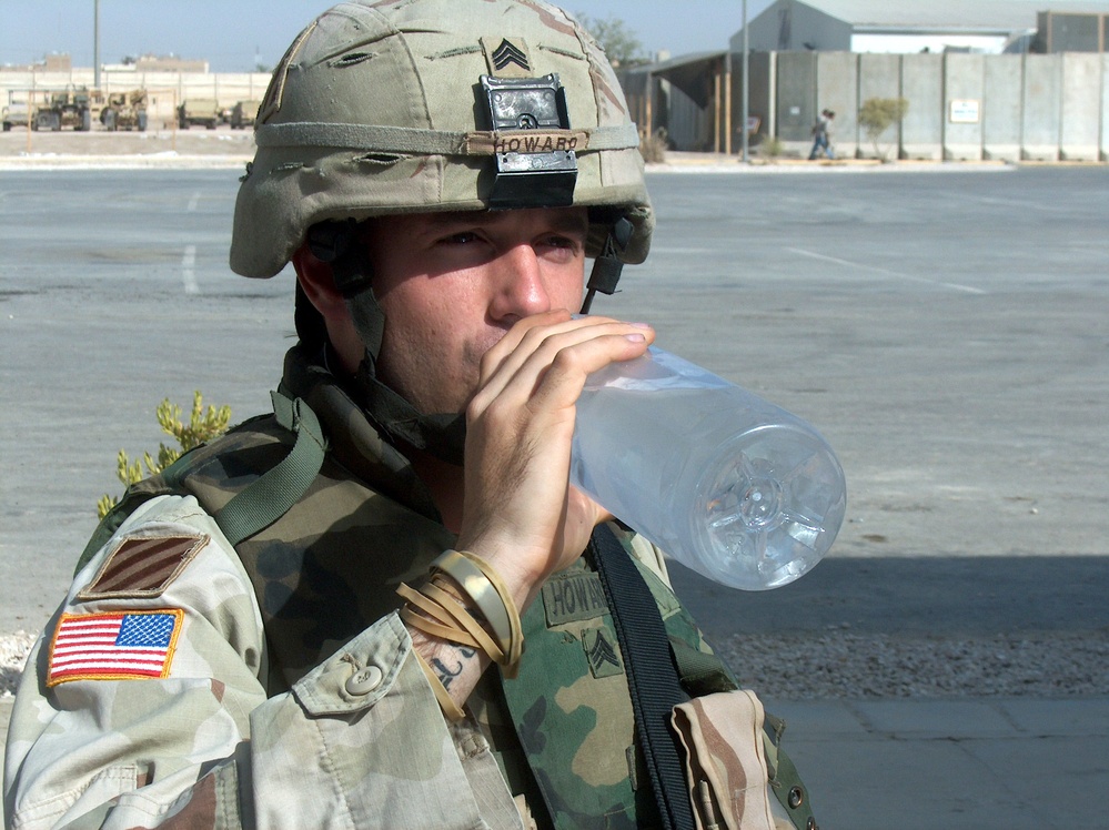 Soldier Stays Hydrated in Baghdad Heat