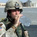 Soldier Stays Hydrated in Baghdad Heat