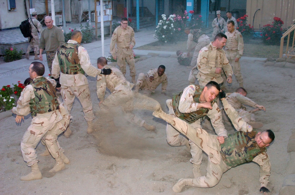 Marines Practice Takedown Techniques in Sand Pit