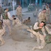 Marines Practice Takedown Techniques in Sand Pit