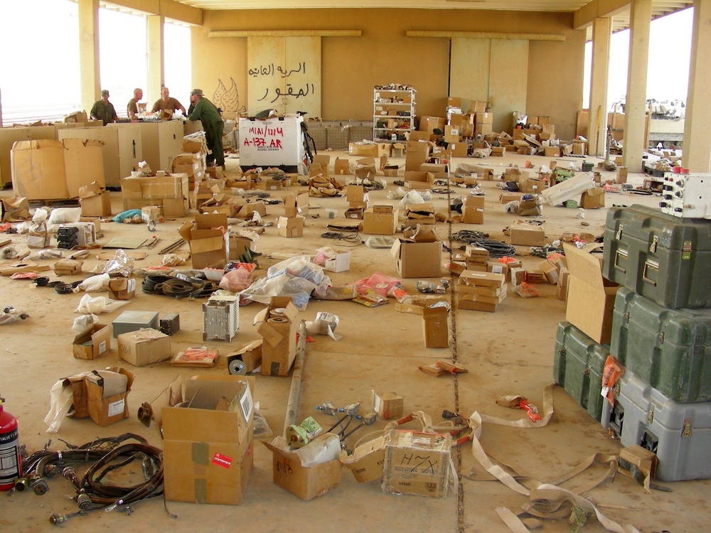 Mechanics Scavenge Parts for Vehicles Before Iraq Deployment