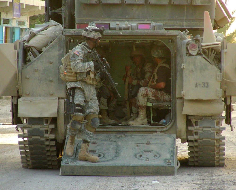 American, Iraqi Troops Patrol Together in Hit, Iraq