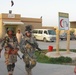 Iraqi, American Soldiers Assist Wounded Man at Hit Hospital