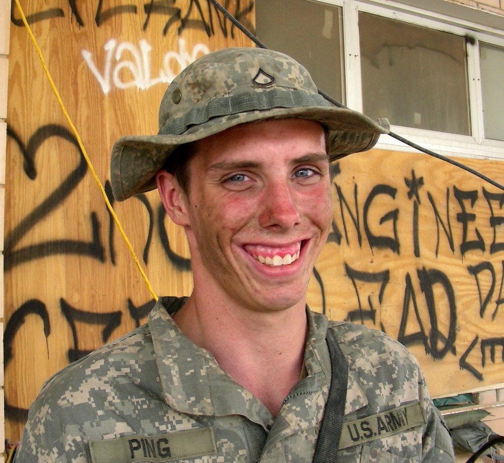 Soldier Maintains Bradley Fighting Vehicle in Iraq