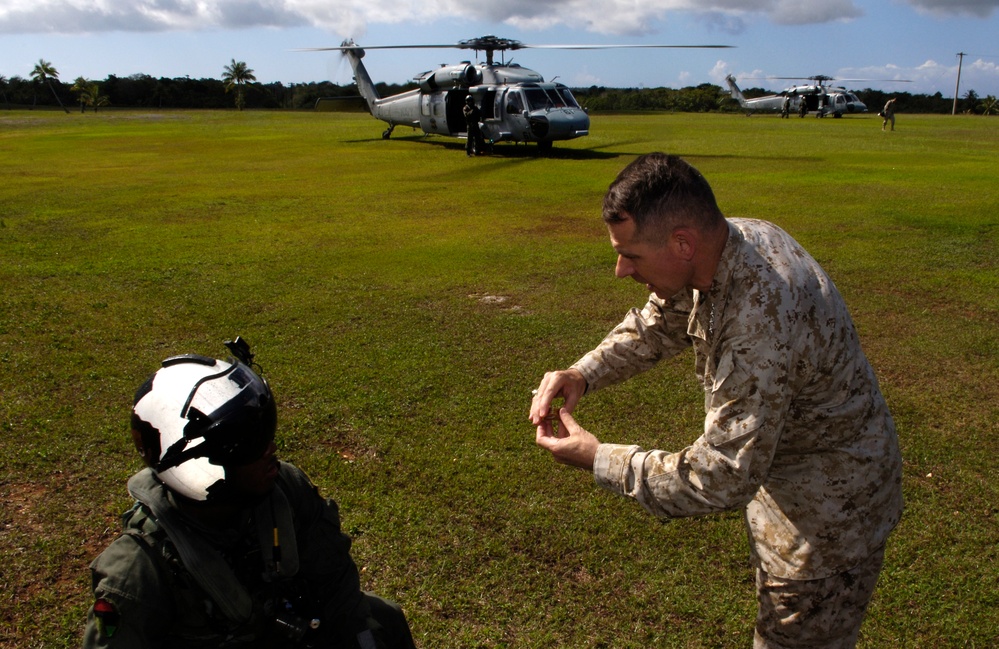Pace Honors Navy Crew with Signature Coins After Guam Tour