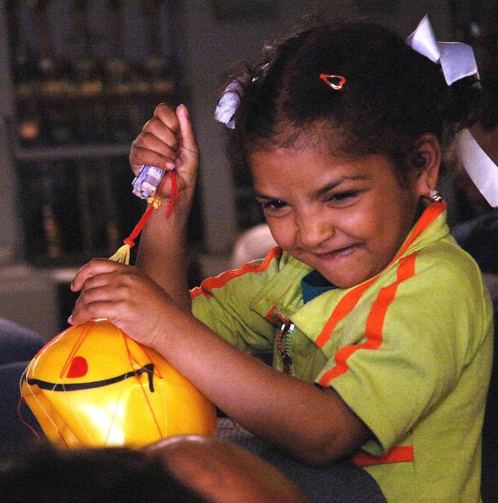 Iraqi Girl Plays as Air Force Assists Returning Patients to Iraq