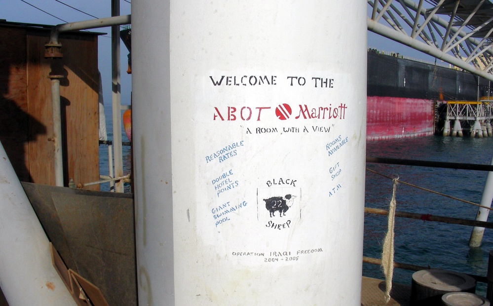 Sailors' Humorous Sign Boosts Al Basra Oil Terminal's Merits