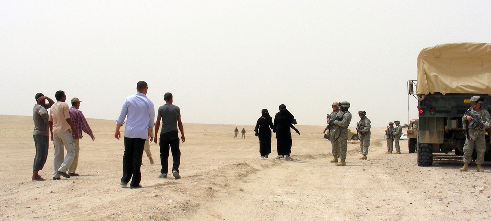 Soldiers Maintain Order as Actors Portray Iraqis at Udairi Range Training Exercise
