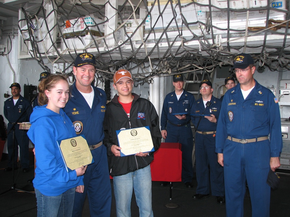 Siblings Honored Aboard Navy Ship for Supporting Troops
