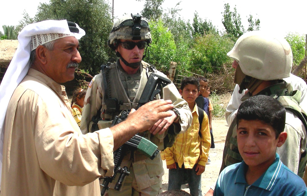 U.S. Soldier Speaks with Iraqi Sheikh Through Interpreter