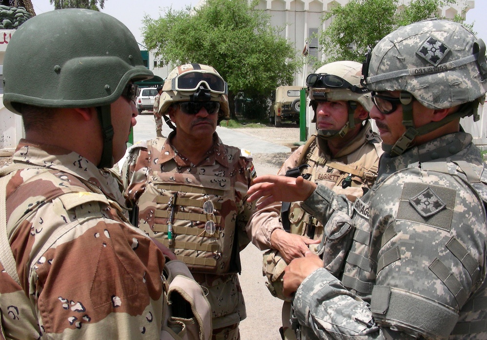Army Captain Leads Discussions with Iraqi Officers at Camp Taji