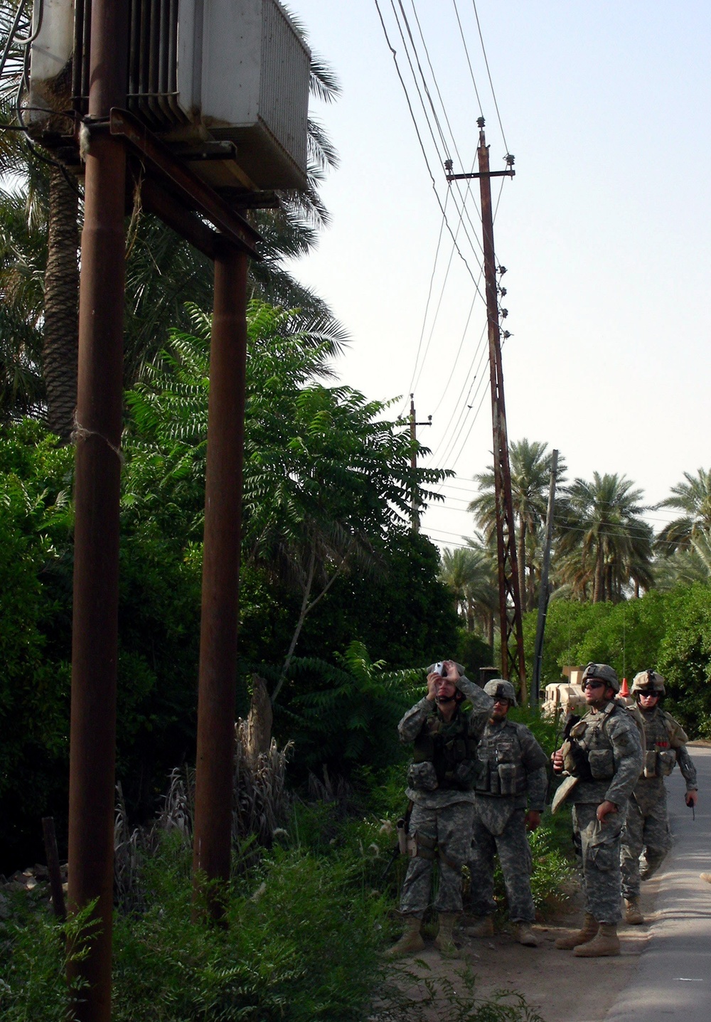 Army Capt. Holly Hanson Surveys Damaged Transformer in Iraq