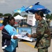 Young Girl Seeks Autograph from Female Airman at Andrews Air Force Base