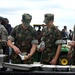 National Guard Sergeant, Marine Reservist, and JROTC Cadets Tour Military Displays