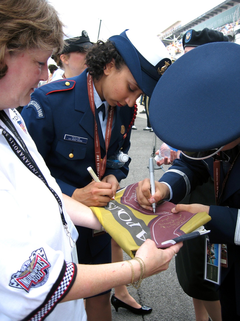 Coast Guard, Air Force Personnel Sign Indianapolis 500 Flag