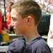 Young Boy Honors National Anthem with Servicemembers