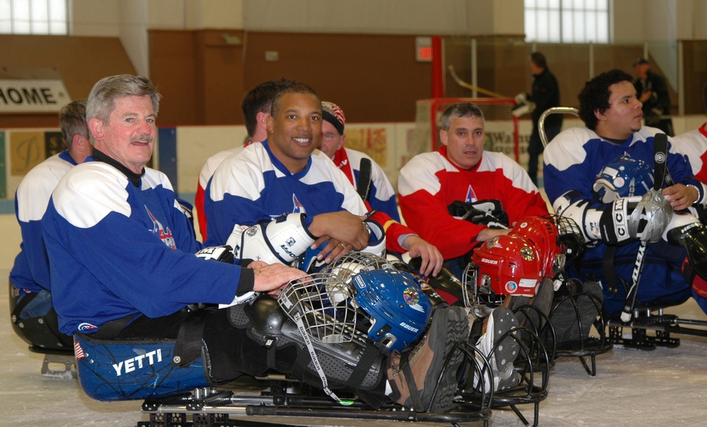 Disabled Veterans Compete in Sled Hockey at Winter Sports Clinic