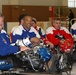 Disabled Veterans Compete in Sled Hockey at Winter Sports Clinic