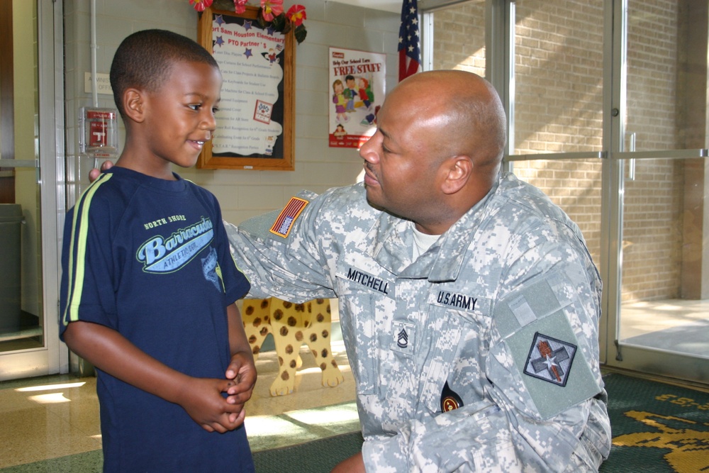 Soldier Reunites with Son at School
