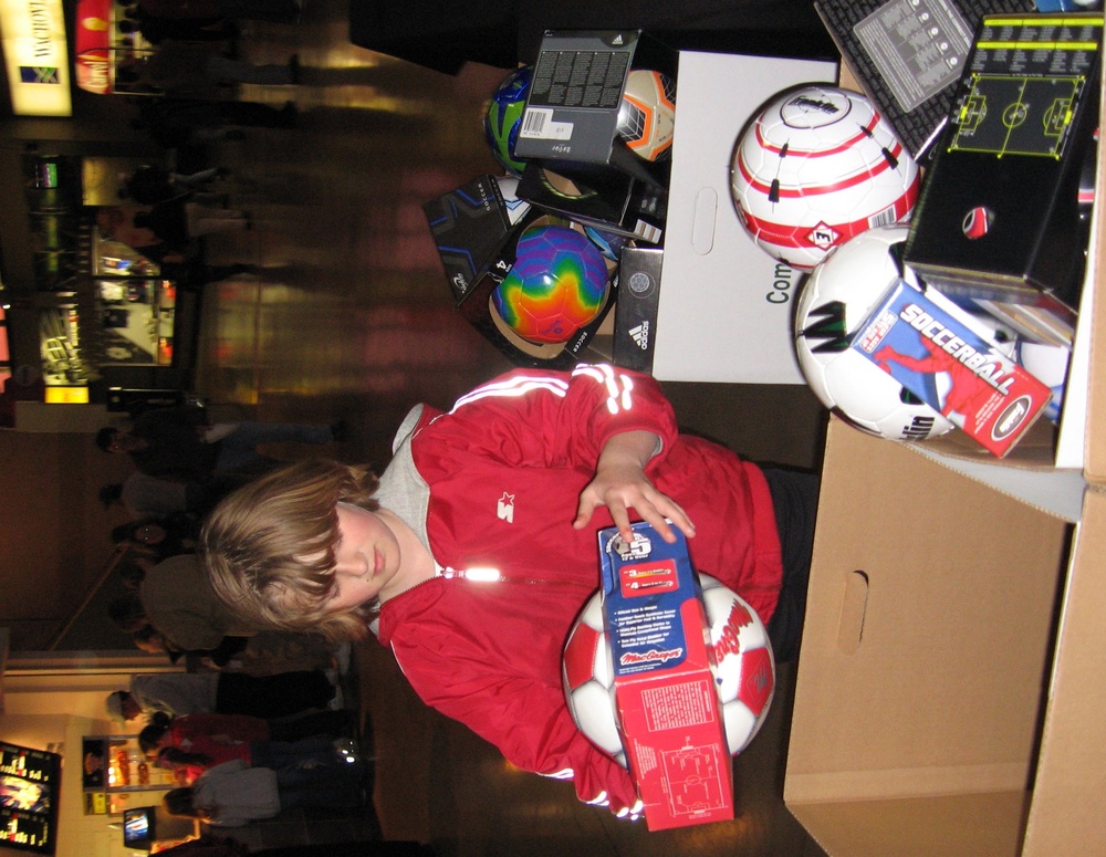 Young Girl Donates Soccer Ball to Charity Drive for Iraqi Children