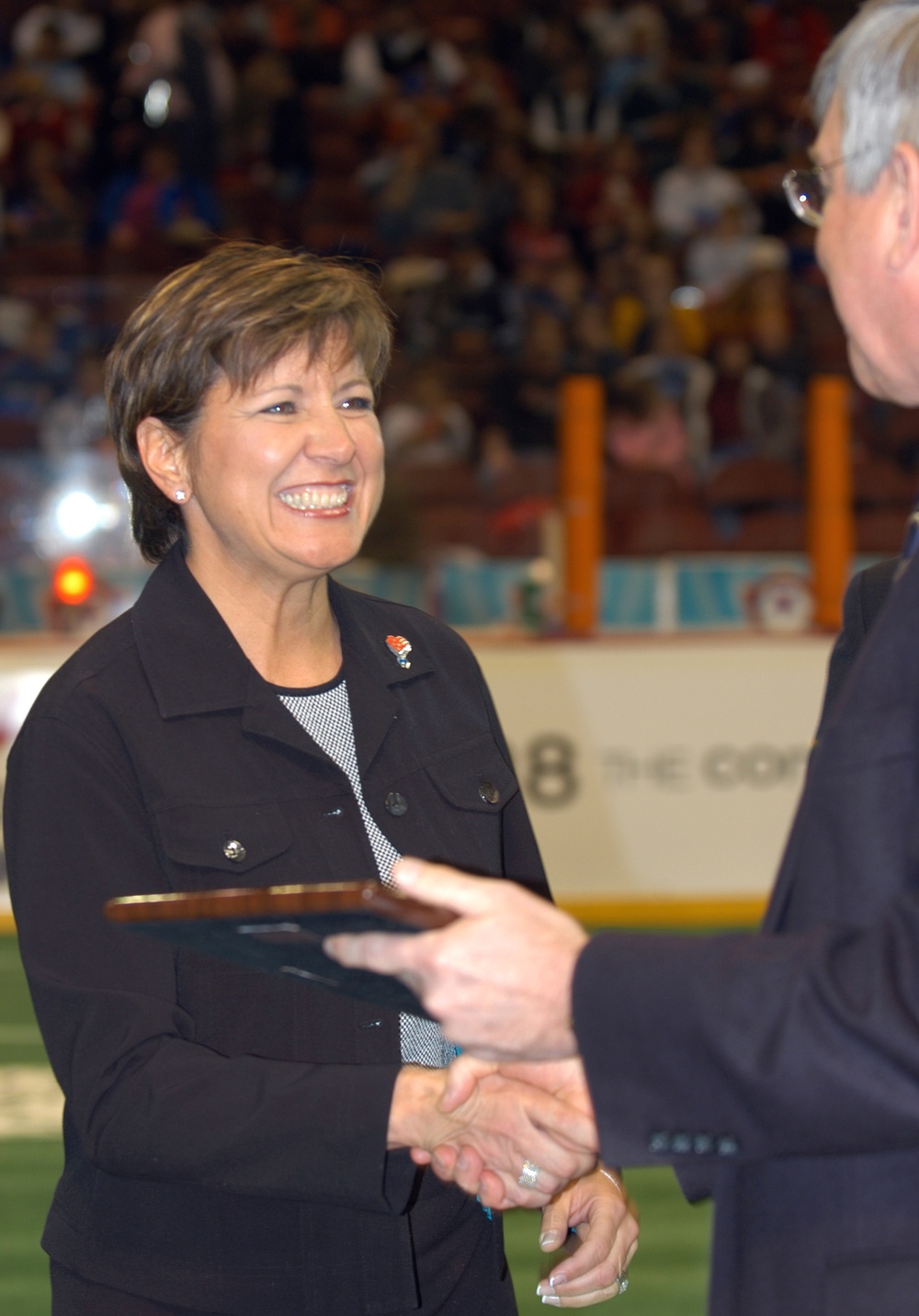 Allison Barber Accepts Plaque from Philadelphia KiXX Owner