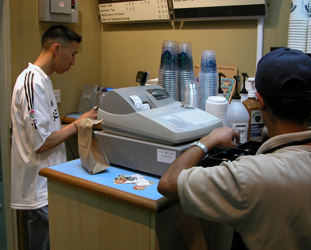 Servicemember Enjoys Coffee Break at Qatar Rest and Recuperation Center