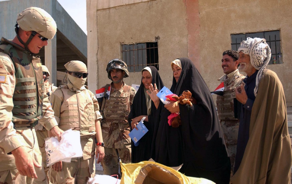 Army Sgt. Distributes Humanitarian Aid at Iraqi Soccer Stadium