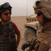 Civilian Investor Discusses Counter-IED Training with Marine in Kuwait