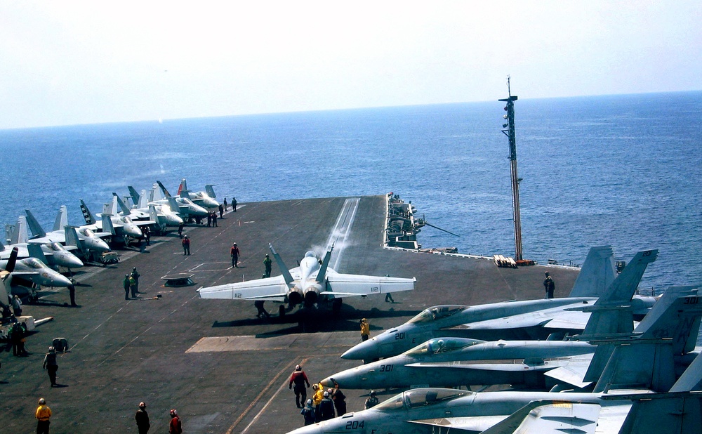 Participants Tour Carrier's Navigation Deck as Crew Prepares F-18 Hornet for Launch