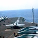 Participants Tour Carrier's Navigation Deck as Crew Prepares F-18 Hornet for Launch