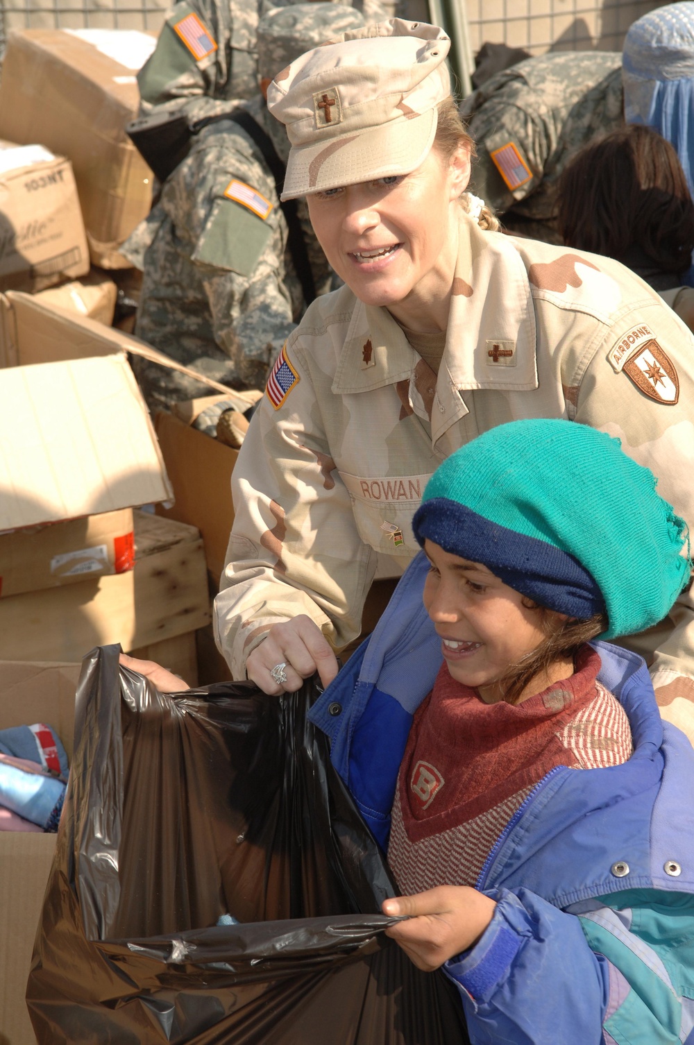 Army Chaplain Helps Afghan Girl Receive Humanitarian Aid at Bagram Air Base