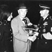 Kasha Zilka Presents Award to 'Gunsmoke' Star Milburn Stone in 1969
