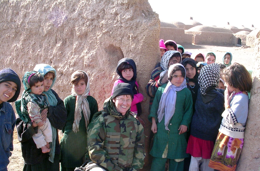 Pioneering Navy Commander Meets Afghan Children