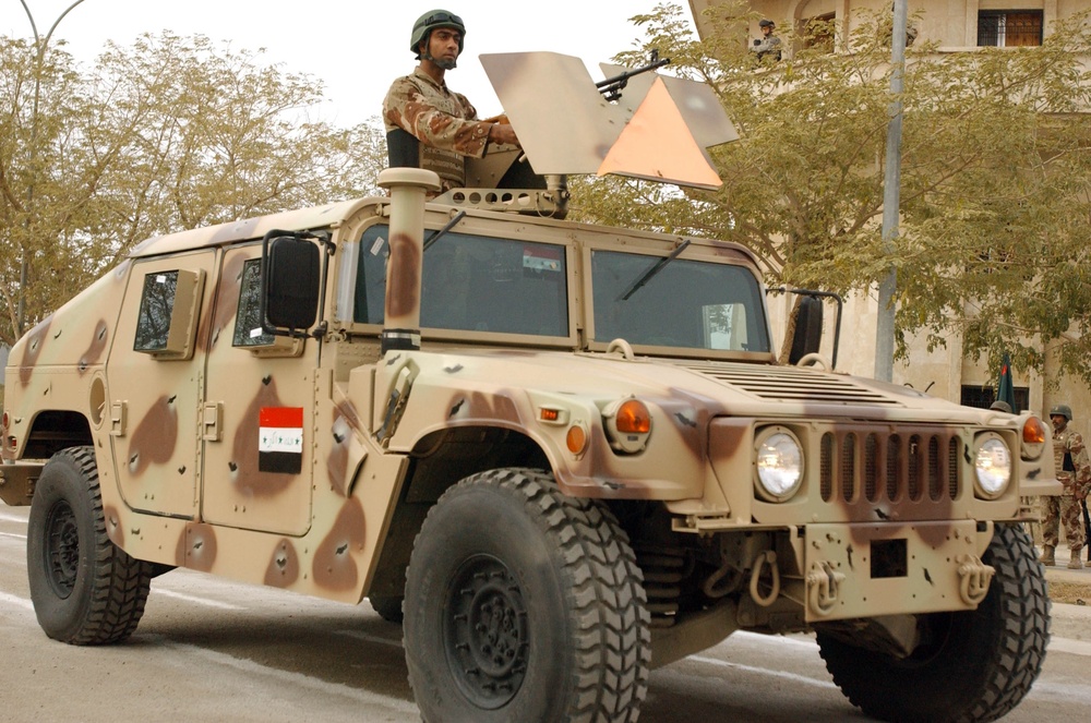 Iraqi Army Soldier Mans Humvee Turret During Ceremony