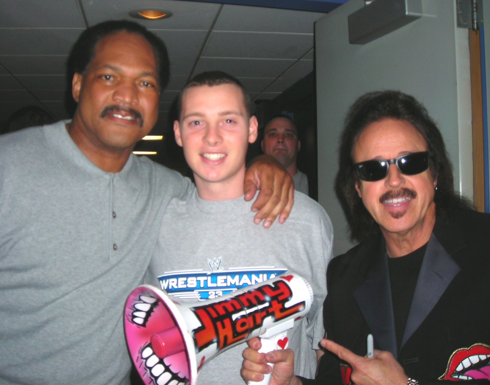 Marine Officer Candidate Poses with WWE Legends at Raw Event