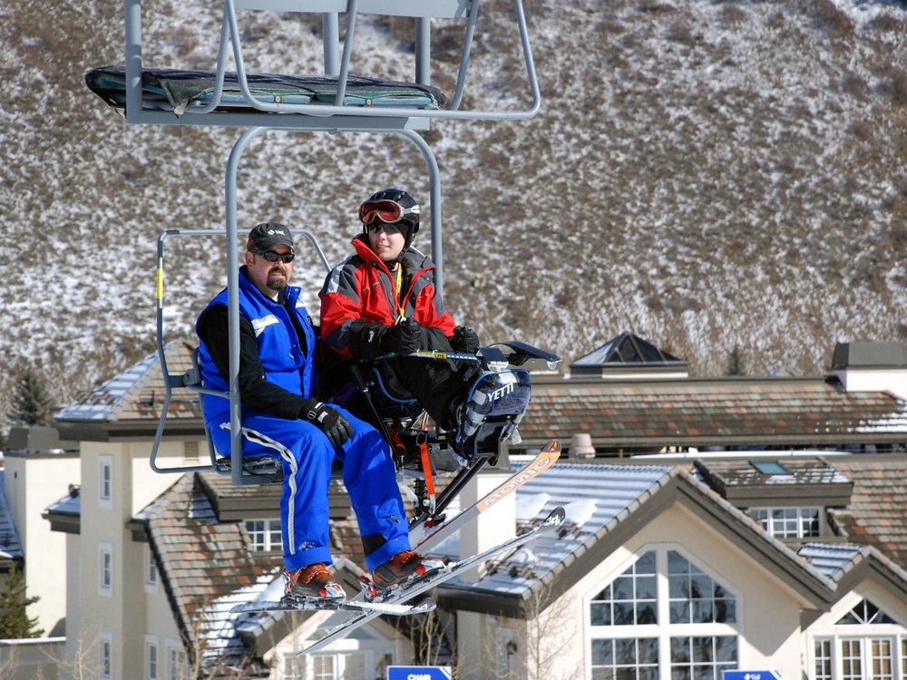 Adaptive Ski Instructor Guides Wounded Warrior on the Slopes